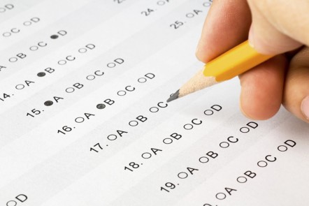 Multiple choice answer sheet being filled in with a pencil
