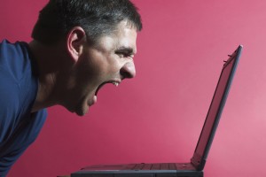 Man shouting at a laptop