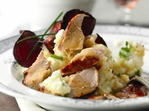 A picture of pheasant with parsnip and apple mash on a white plate
