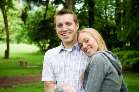 Young man and woman in park together