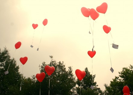 Red balloons with envelopes attached