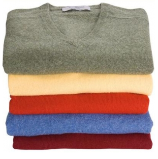 A stack of coloured v neck jumpers