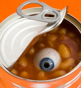 A false eye in a baked bean can.