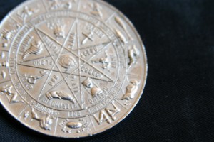 A coin with the signs of the zodiac on it